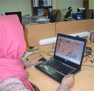 Female engineer in Afghanistan working on a laptop 